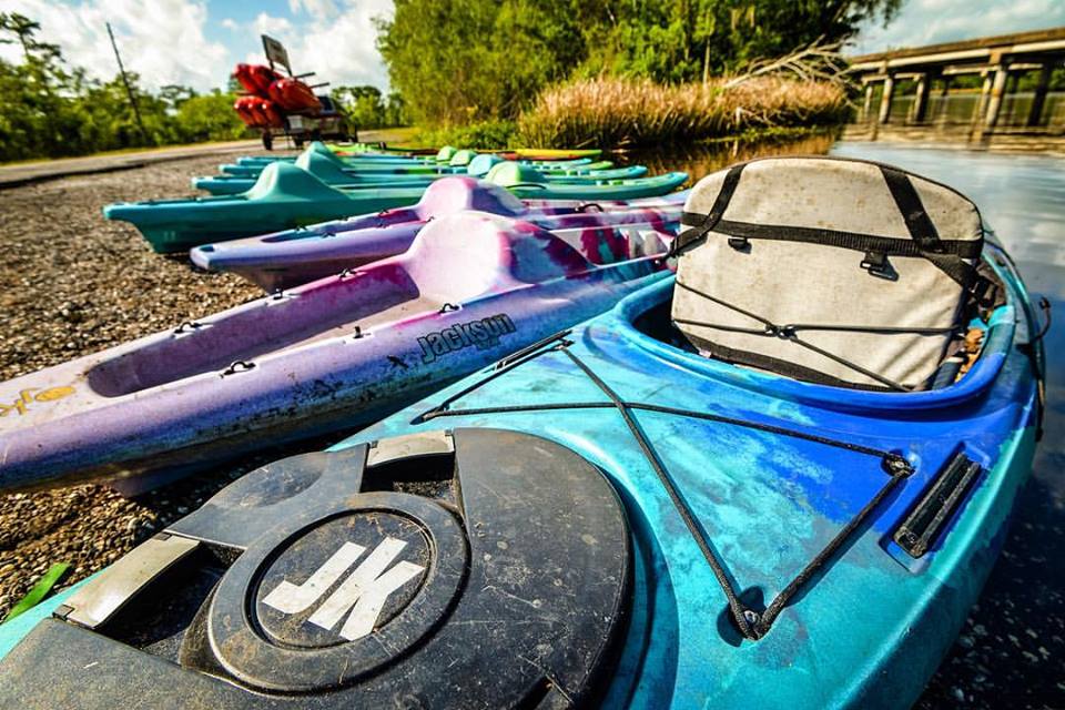 A group of Jackson Kayaks along the bayou.