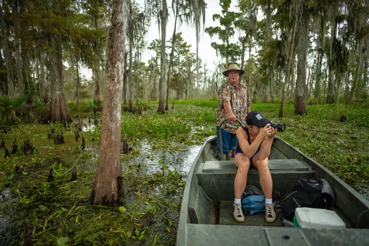 a man riding a skateboard up the side of a tree